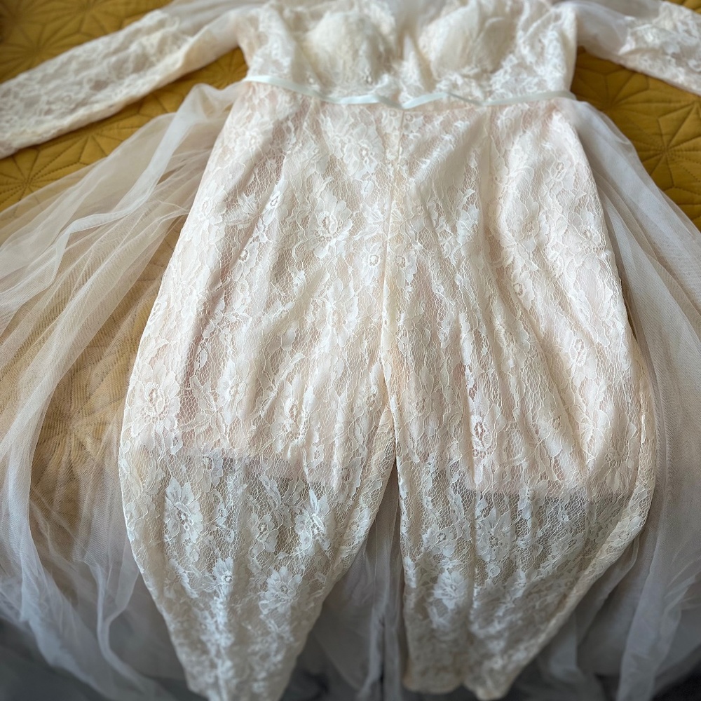 Bridal jumpsuit with over skirt train